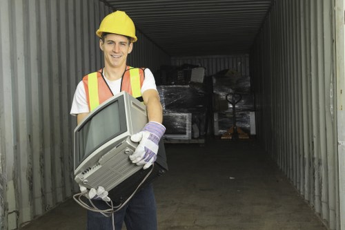 Workers managing builders waste clearance