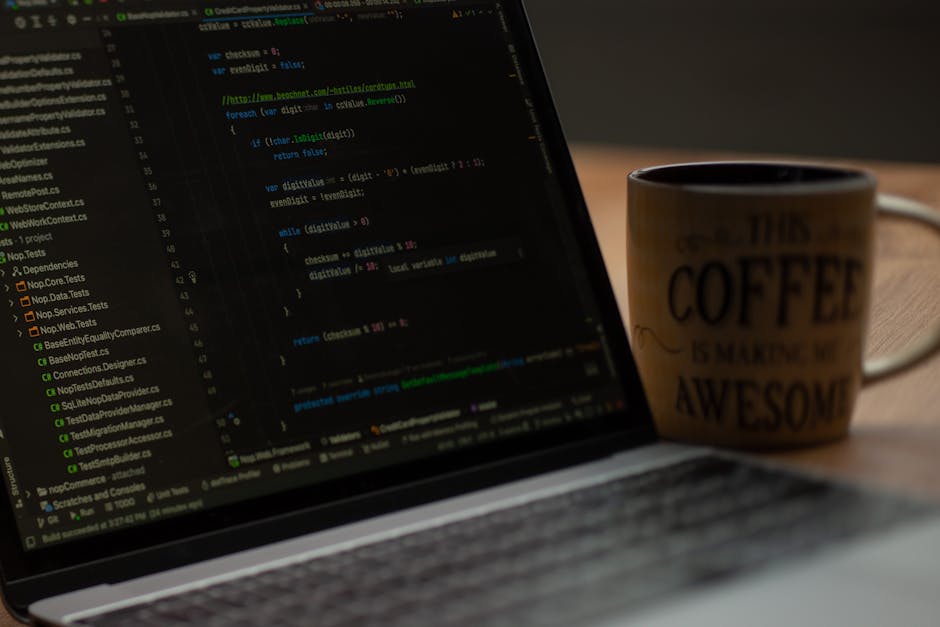 Close-up of a computer screen displaying lines of HTML code in multiple colours, including blue, yellow, red, and green, on a dark background. The code references image file paths such as 'bibek's pho